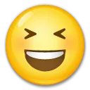 Mosolygó arc nyitott szájjal és szorosan csukott szemmel